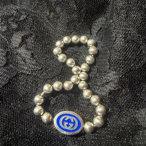 Gucci Silver Bracelet with Blue Logo